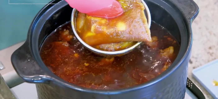 Remove spice bags, squeeze out liquid. Remove beef neck bones, separate meat from bones, discard bones.