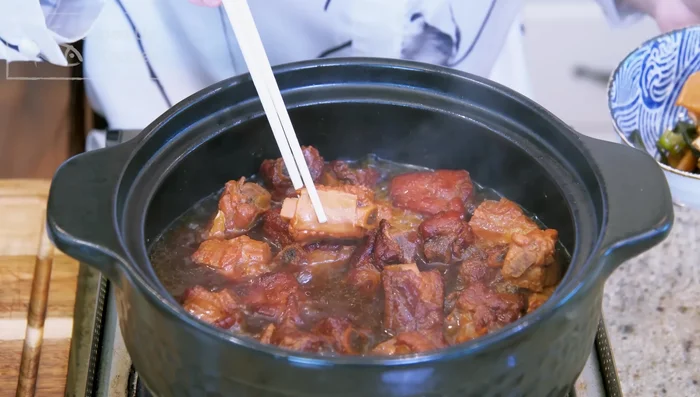 Discard soggy aromatics. Turn heat to high and stir constantly to reduce the sauce until thick.