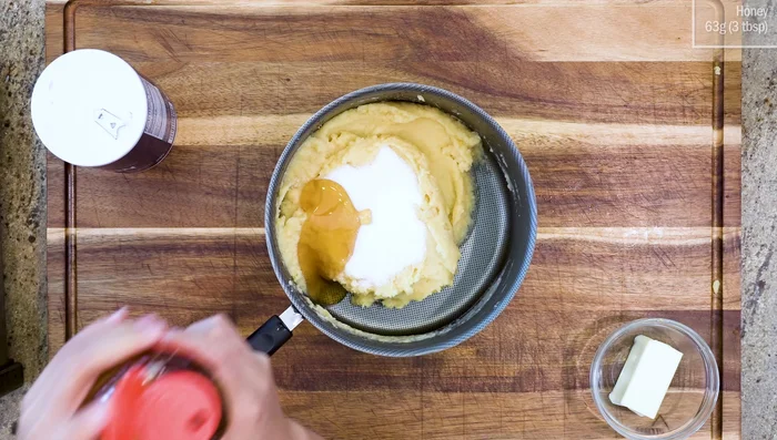Return the pot to the stove and stir in the sugar, honey, salt, and butter until melted.