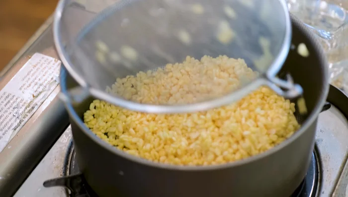 Add the mung beans to a non-stick pot and add 1 1/4 cups of water. Bring to a simmer over medium heat.