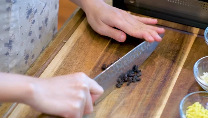 Prepare the sauce: In a wok, sauté fermented black beans, garlic, and ginger until golden. Add soy sauce, oyster sauce, hoisin sauce, and chilli bean paste. Stir and set aside.