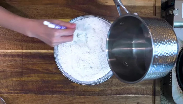 Pour the boiling water into the flour mixture and stir until well combined. Cover and let cool to lukewarm.