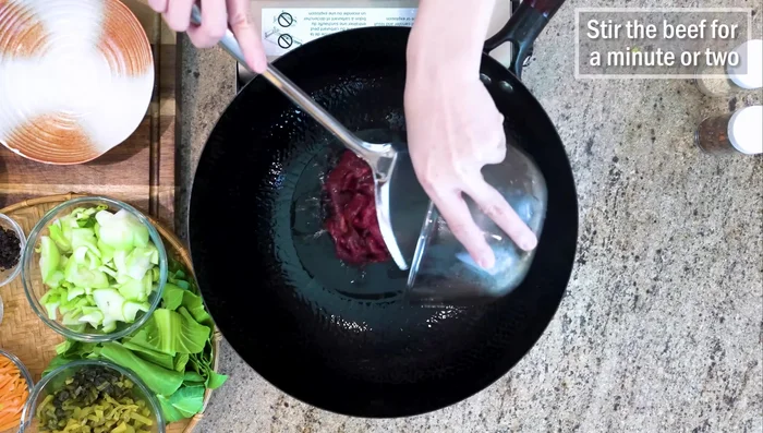 Add more oil to the wok, stir-fry the beef until browned. Remove and set aside.