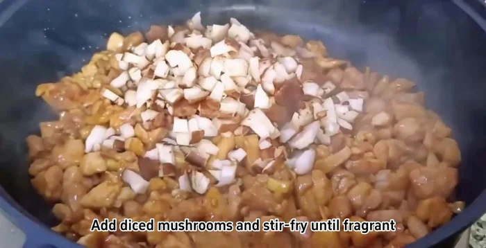 Add diced mushrooms and stir-fry until fragrant. Add peas and stir-fry evenly.