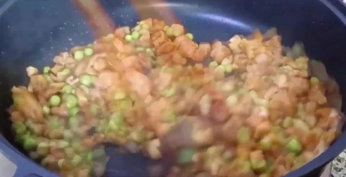 Add onions and stir-fry evenly.