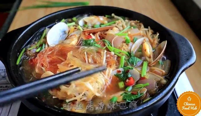 Simmer for a few minutes until the noodles are heated through and the clams are cooked.