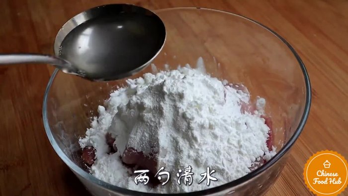 Coat the pork in potato starch and egg