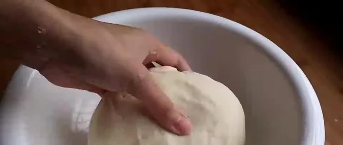 Divide the dough into small portions. Roll each portion into a circle.
