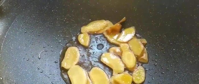 Add the minced ginger and stir-fry for a short while.