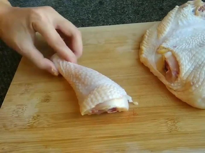 Prepare the chicken by cutting it into pieces. (This step is implied based on the audio but not explicitly stated.)