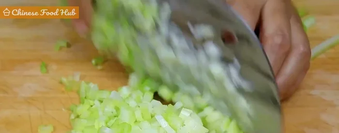 Prepare celery: Dice celery into small pieces. Toss with peanut oil to prevent excess moisture. (112.22)