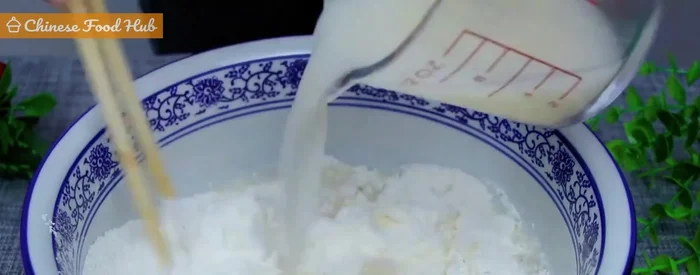 Combine flour and yeast mixture: Gradually add flour to the yeast mixture, mixing until it forms a crumbly texture. (26.58)