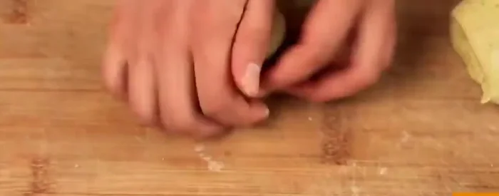 Layer the dough (the exact method is not detailed, but likely involves multiple thin layers).