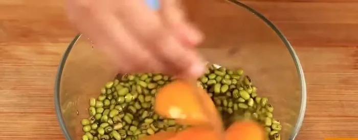Mix mung bean paste with flour, sugar, and water to form a dough.