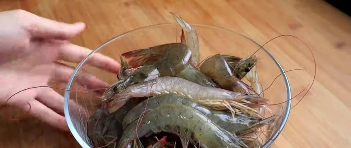 Prepare the shrimp by cleaning and processing them. This step involves creating a paste or mixture from the shrimp.