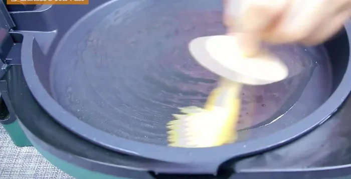 Heat an electric griddle, brush with oil. Place the dough balls on the griddle, leaving space between them. Brush the tops with oil, cover, and cook for 5 minutes, flipping halfway.