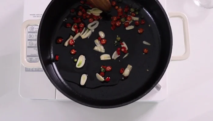 Add the tofu puffs and stir-fry until lightly browned.