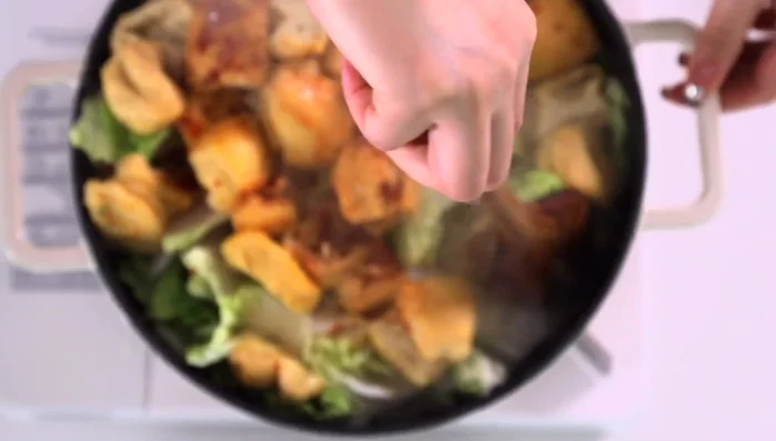 Add water to cover the ingredients, bring to a simmer, and cook until the cabbage is tender.