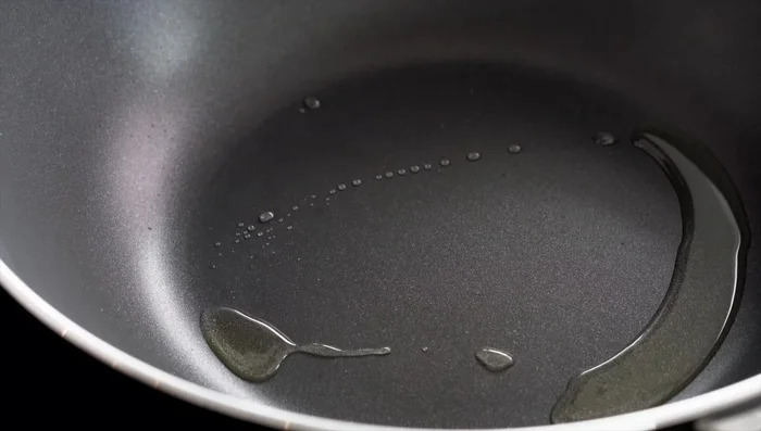 Add noodles and break them up with chopsticks or spatula.