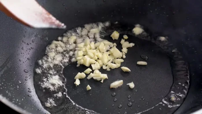 Add sugar and sesame oil, and stir-fry for a few minutes.