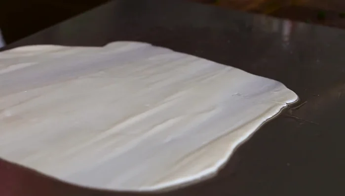 Carefully roll up the dough tightly into a log.