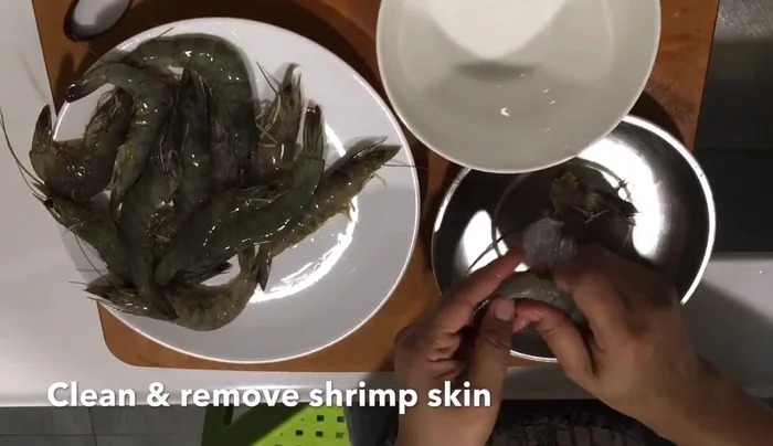 Cook the shrimp and eggs together. (This step is inferred; details missing from transcript)