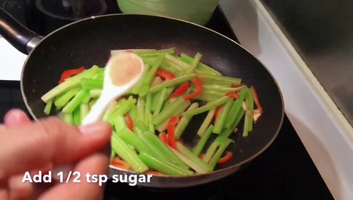 Add the celery and continue to stir-fry until it is tender-crisp.