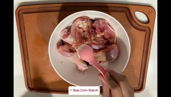 Add tomatoes, corn, soy sauce, sugar and water. Bring to a boil, then reduce heat and simmer. (This step is inferred)