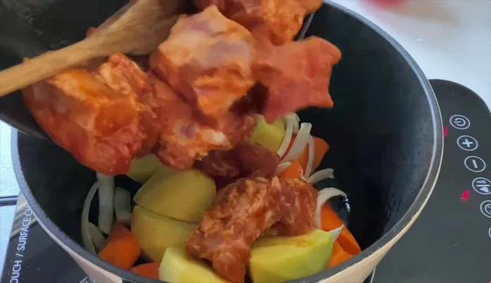 Simmer the riblets in the beer until they are tender. (Duration is not specified in the transcript.)