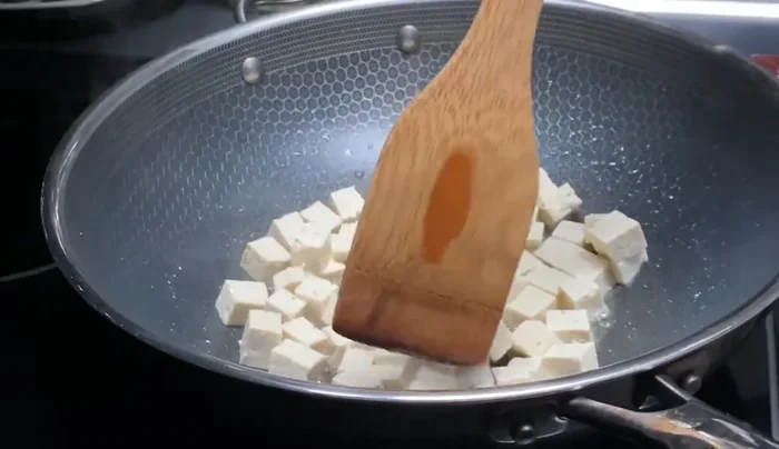 Continue cooking and stirring, potentially adjusting seasoning.