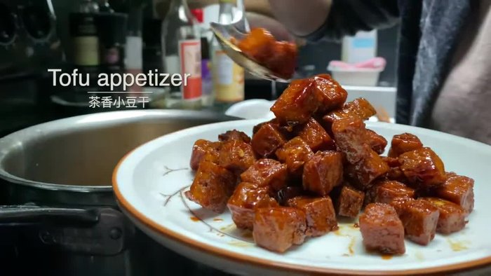 Prepare the tofu. (Exact method unclear from audio)