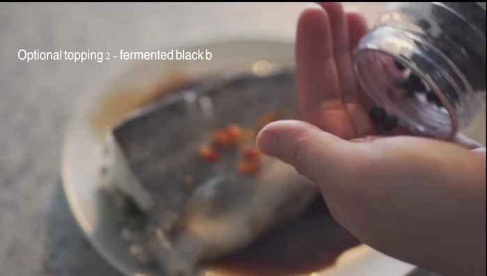 Garnish (optional): Add chili paste, black fermented beans, and scallions. Pour hot oil over the scallions and fish.