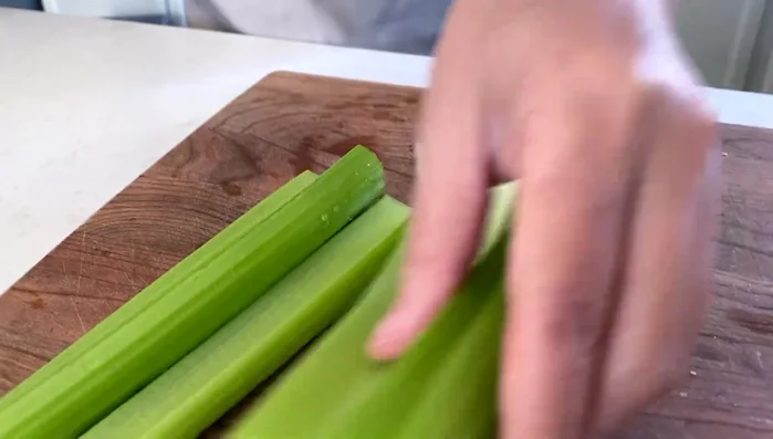 Blanch celery in boiling water for 10-15 seconds, then chop finely. (43.28)