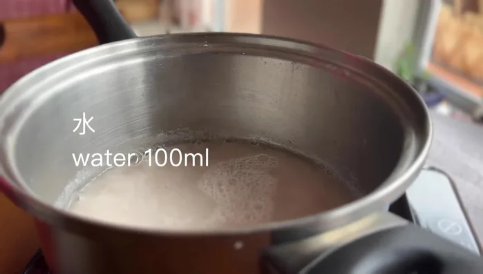 Gently heat the taro paste to around 90 degrees Celsius (barely simmering). Turn off the heat.