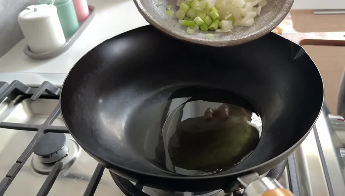 Sauté onion and scallions until fragrant.