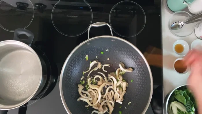 Add mushrooms to the pan and cook briefly.