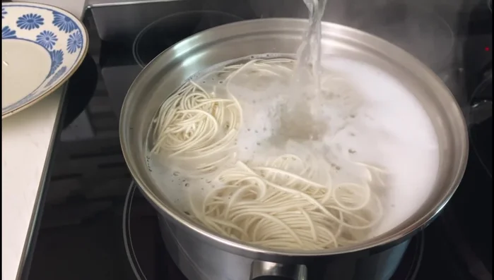 Add noodles to the broth; bring to a boil again and stir in pork chops.