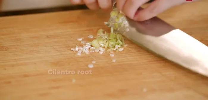 Prepare the red curry paste: finely chop cilantro root, shallots, lemongrass, garlic, galangal, kaffir lime leaves (zest only), and dry chilies.
