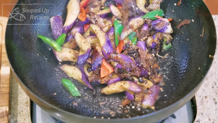 Taste and adjust seasoning with fish sauce if needed. Add diced scallions and mix well.