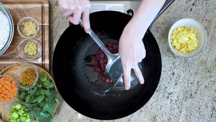 Add more oil to wok. Add beef and pan-fry for about 30 seconds per side, stirring until charred. Remove beef from wok.