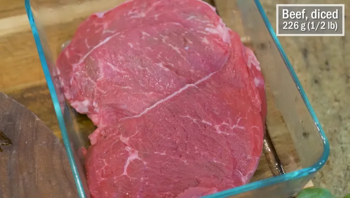 Cut sirloin tip steak into ⅓ inch thick strips, then dice into cubes. Marinate with soy sauce, dark soy sauce, white pepper, and baking soda.