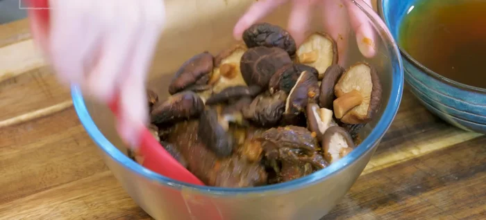 Drain and squeeze soaked mushrooms. Add to marinated beef.