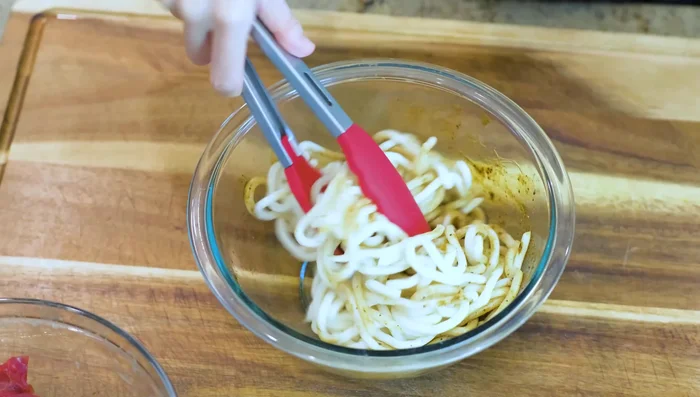 Toss the noodles with the sauce.