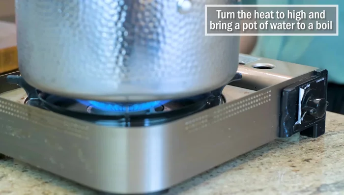 Bring a pot of water to a boil. Cut the beef into 1/4-inch thick slices.