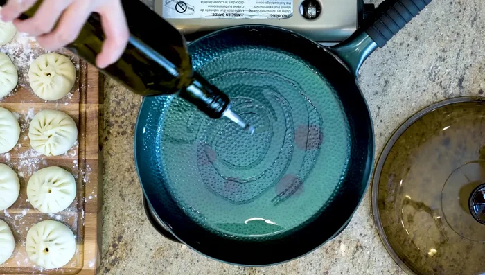 Pan-fry the buns: Heat oil in a pan over medium heat. Add buns, leaving space between them. Mix cornstarch and water to make a slurry.