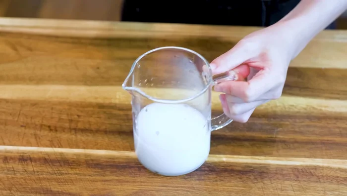 Pour the cornstarch slurry into the pan, cover, and cook for about 8 minutes, adjusting heat as needed to maintain even cooking.