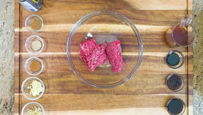 Prepare the filling: Mix ground beef, soy sauce, oyster sauce, dark soy sauce, garlic, ginger, 5 spice powder, white pepper, Sichuan peppercorn powder, and sesame oil. Stir in beef stock and mix in one direction.