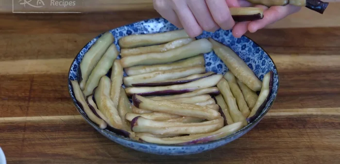 Add eggplant to the wok and stir-fry for 2 minutes over medium heat until soft and tender.