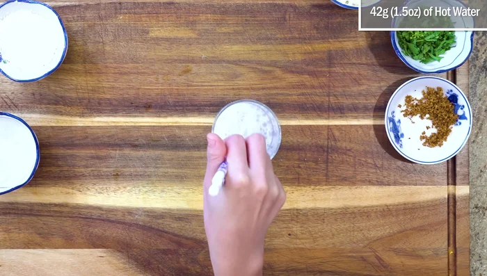Make the baking soda solution: Combine baking soda and water. Add crushed ice to cool the solution.