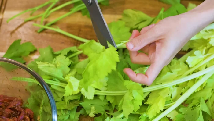 Prepare Chinese celery by removing leaves and root, cutting stalks into 2.5 inch pieces. (Regular celery can be substituted).